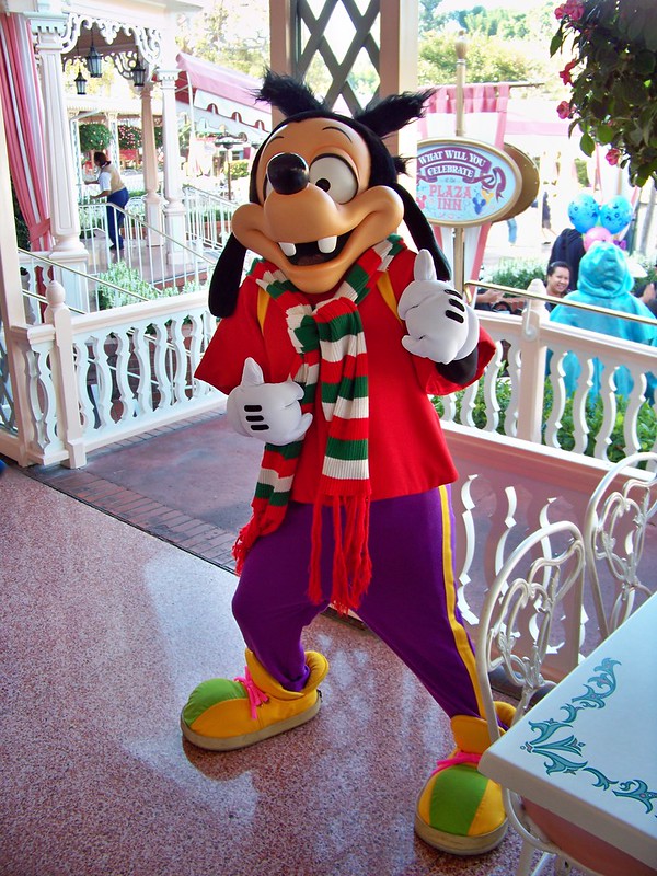 Max in holiday wear at Breakfast in the Park with Minnie & Friends at the Plaza Inn Disneyland. Keep reading to get the best restaurants at Disneyland for adults.