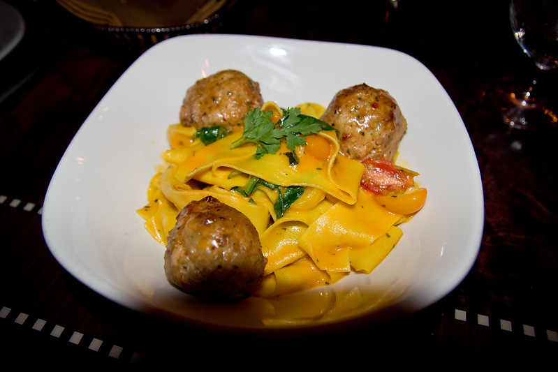 Pappardelle Pasta with House-made Chicken Meatballs - with Tear Drop Tomatoes, fresh Basil, and Yellow Tomato Essence at Carthay Circle in Disney California Adventure. Keep reading to get the best restaurants at Disneyland for adults.