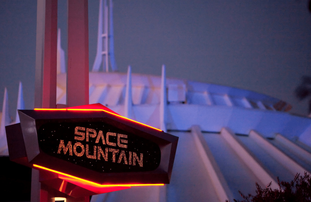 Space Mountain at Disneyland Entrance. Keep reading to figure out which is better for Space Mountain Disneyland vs Disney World.