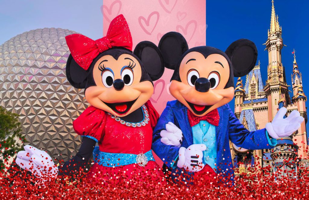 What to Wear to Disney World in February with Mickey and Minnie Mouse in front of Spaceship Earth and Cinderella Castle. Keep reading to know what to wear to Disney World in February and what to pack for Disney World in February!