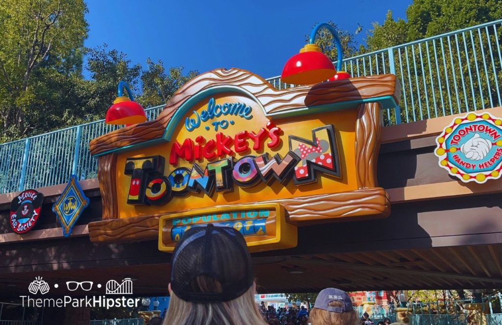 Disneyland Resort Mickey's Toontown Welcome Sign. Keep reading about Mickey and Minnie's Runaway Railway at Disneyland vs Disney World.