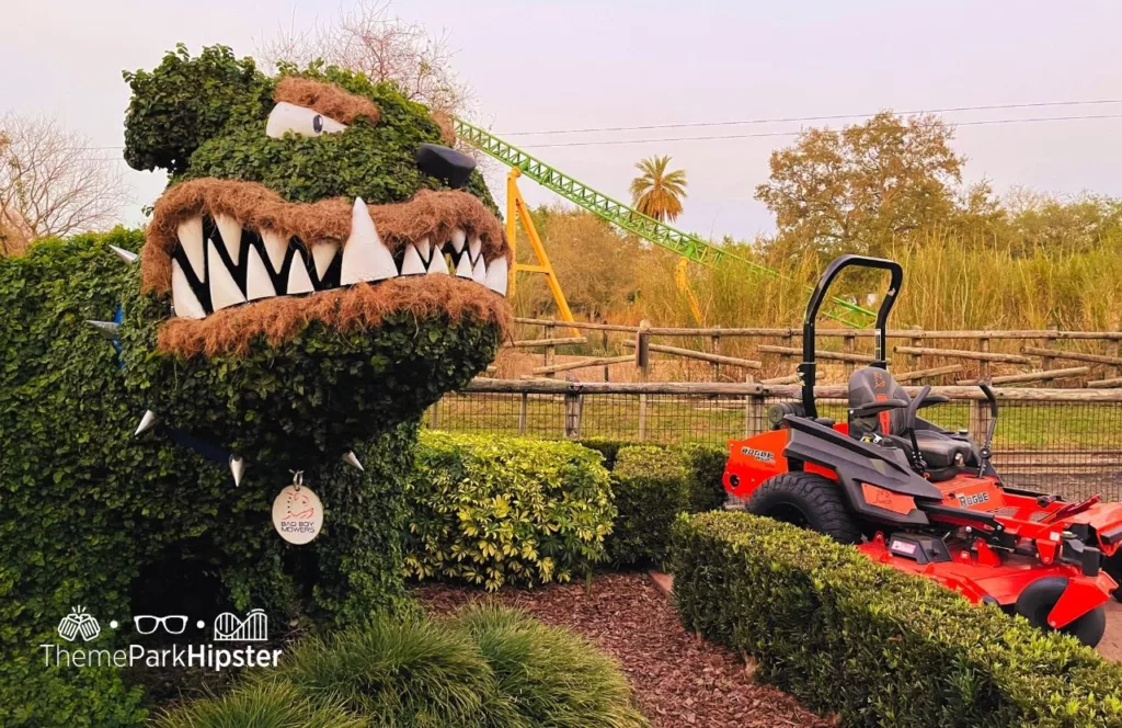 Busch Gardens Tampa Topiary dog next to cheetah hunt roller coaster. Keep reading to get the Groupon Busch Gardens Tampa Deals.