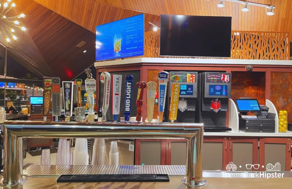 Springs Taproom bar and beer area during Busch Gardens Tampa Food and Wine Festival with various beers on tap. Keep reading to find out more about what to eat at Busch Gardens Tampa.