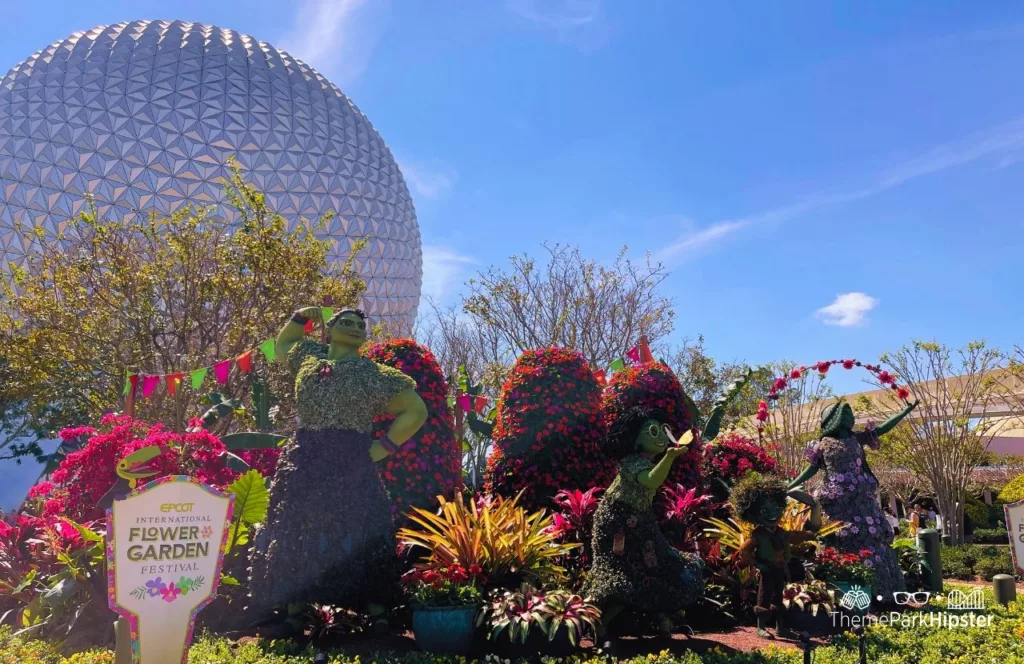 Epcot Flower and Garden Festival 2023 Encanto Topiary at the Entrance near Spaceship Earth. Keep reading to see the best epcot flower and garden topiaries through the years!