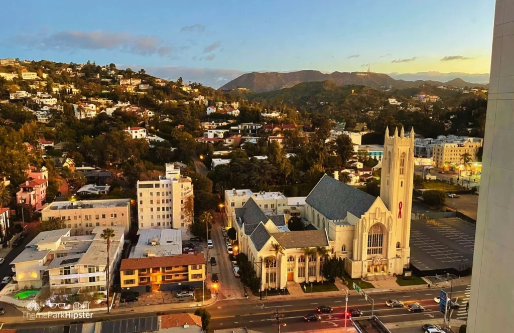 Loews Hollywood Hotel near Universal Studios Hollywood View of Famous Church and Hollywood Sign. Keep reading to get the full guide on which is better Disneyland vs Universal Studios Hollywood.