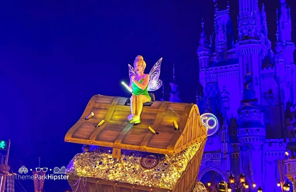 Mickey's Not So Scary Halloween Party at Disney's Magic Kingdom Theme Park Boo to You Halloween Parade in front of Cinderella Castle with character Tinker Bell. Keep reading to know what to pack and what to wear to Disney World in October for your packing list.