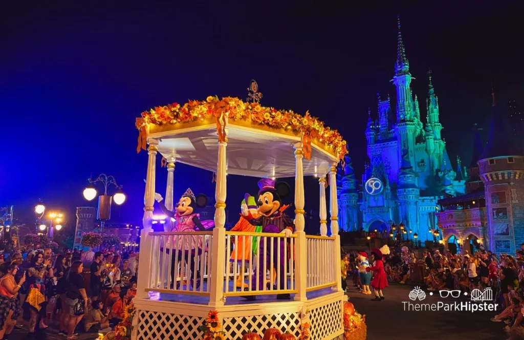 2023 Mickey's Not So Scary Halloween Party at Disney's Magic Kingdom Theme Park Boo to You Halloween Parade in front of Cinderella Castle with characters Mickey and Minnie Mouse.