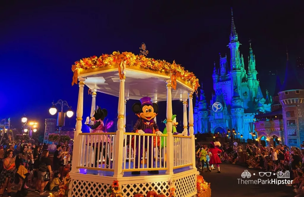 Mickey's Not So Scary Halloween Party at Disney's Magic Kingdom Theme Park Boo to You Halloween Parade in front of Cinderella Castle with characters Mickey and Minnie Mouse. Keep reading to know what to pack and what to wear to Disney World in August for your packing list.