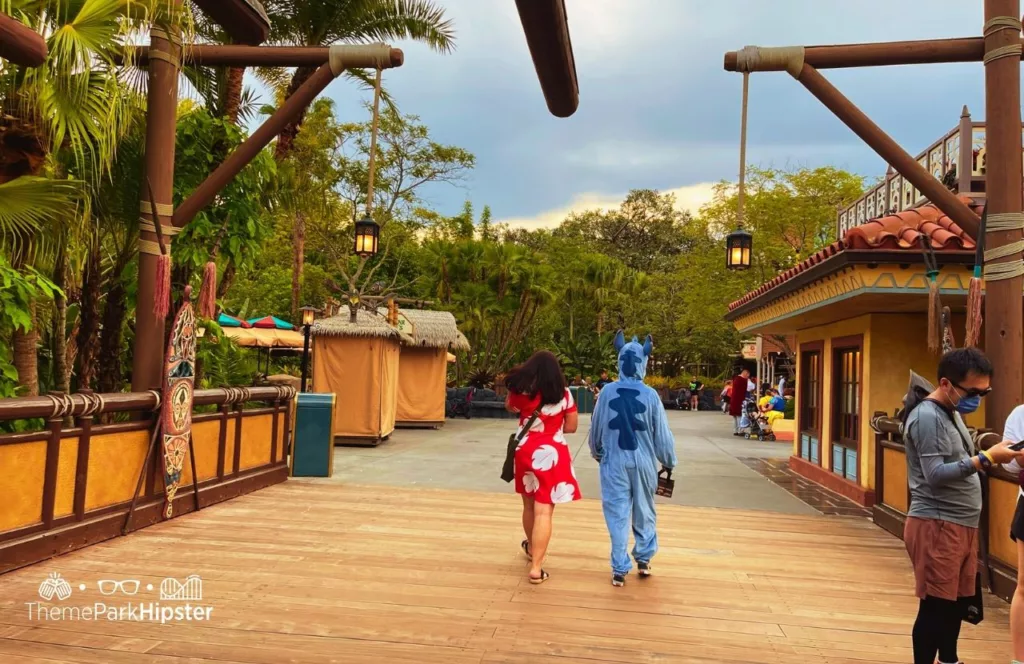 Mickey's Not So Scary Halloween Party at Disney's Magic Kingdom Theme Park Entering Adventureland with people dressed like Lilo and Stitch Costumes. Keep reading to know what to pack and what to wear to Disney World in October for your packing list.