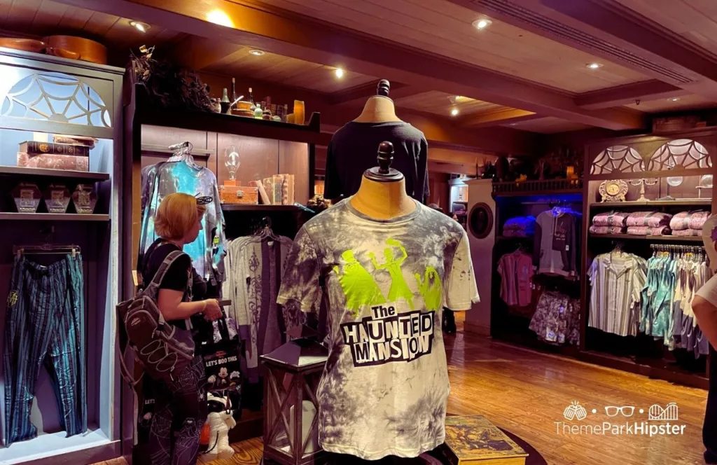 Mickey's Not So Scary Halloween Party at Disney's Magic Kingdom Theme Park Haunted Mansion Merchandise in Memento Mori Store Shirts. Keep reading to know what to pack and what to wear to Disney World in August for your packing list.