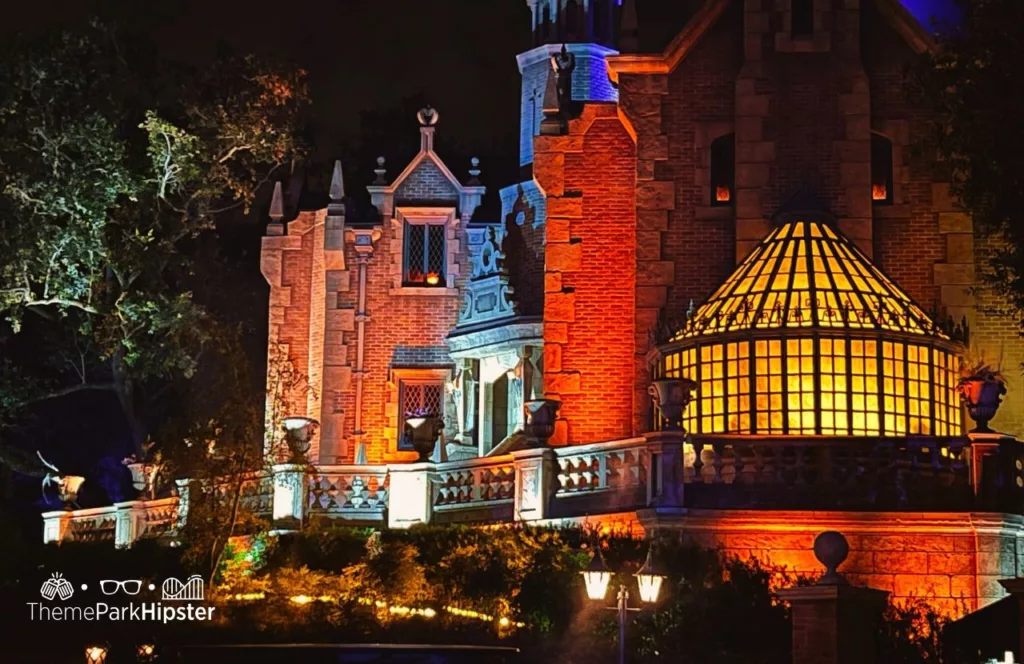 Mickey's Not So Scary Halloween Party at Disney's Magic Kingdom Theme Park Haunted Mansion close up View at Night. Keep reading to get the best rides at Magic Kingdom for Genie Plus and Disney Lightning Lane.