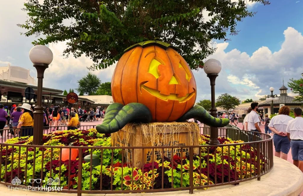 Mickey's Not So Scary Halloween Party at Disney's Magic Kingdom Theme Park Large Pumpkin at Entrance. Keep reading for more Halloween at Disney things to do and events with fall decor.