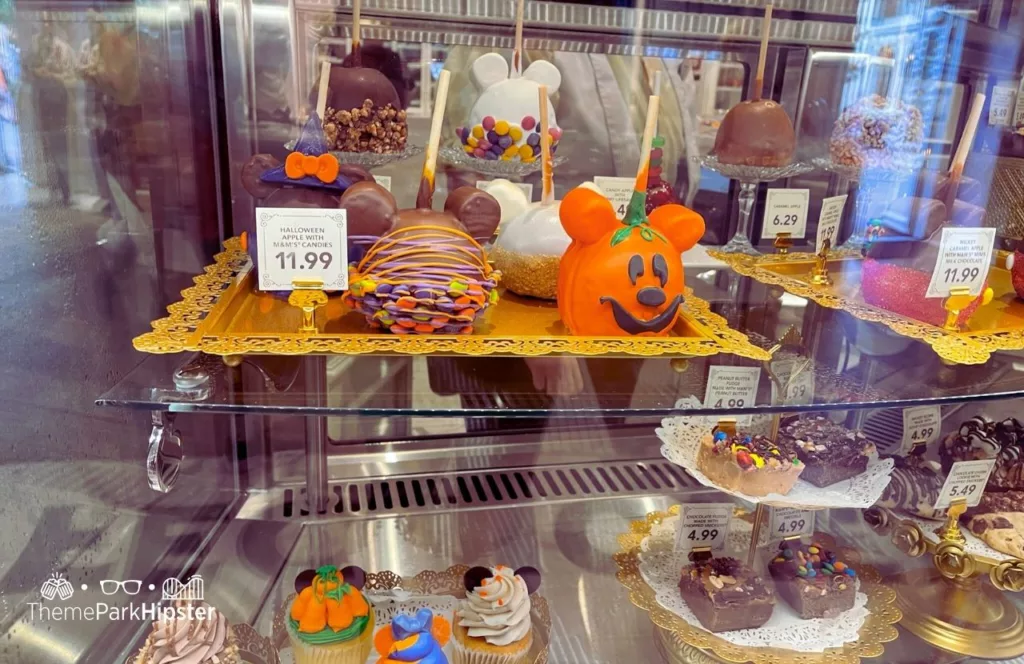 Mickey's Not So Scary Halloween Party Food at Disney's Magic Kingdom Theme Park Main Street Confectionery with Halloween Pumpkin Candy Apples Food and Treats