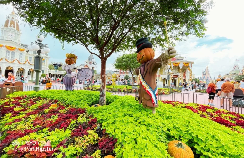 2023 Mickey's Not So Scary Halloween Party at Disney's Magic Kingdom Theme Park Main Street USA Scarecrows with Cinderella Castle. Keep reading to get the guide to Mickey's Not So Scary Halloween Party Tips with Photos, Parade details, characters, rides and more!