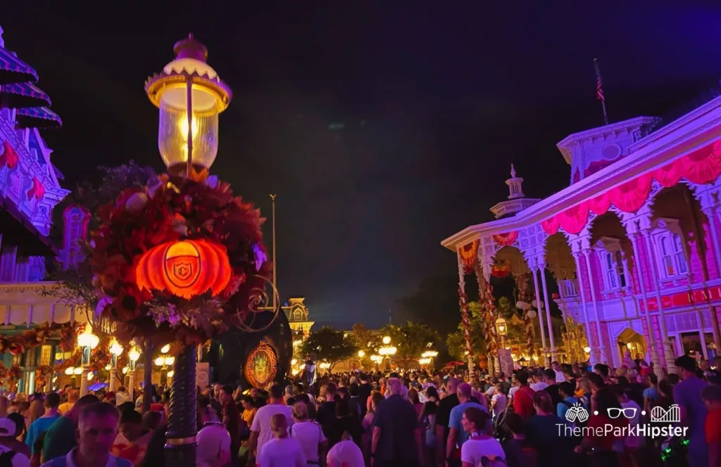 Mickey's Not So Scary Halloween Party at Disney's Magic Kingdom Theme Park Main Street USA at Night large crowd.