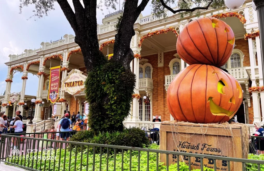2023 Mickey's Not So Scary Halloween Party at Disney's Magic Kingdom Theme Park Town Square Theater for Mickey and Minnie and Jack and Sally Meetup next to pumpkins. Keep reading to get the guide to Mickey's Not So Scary Halloween Party Tips with Photos, Parade details, characters, rides and more!