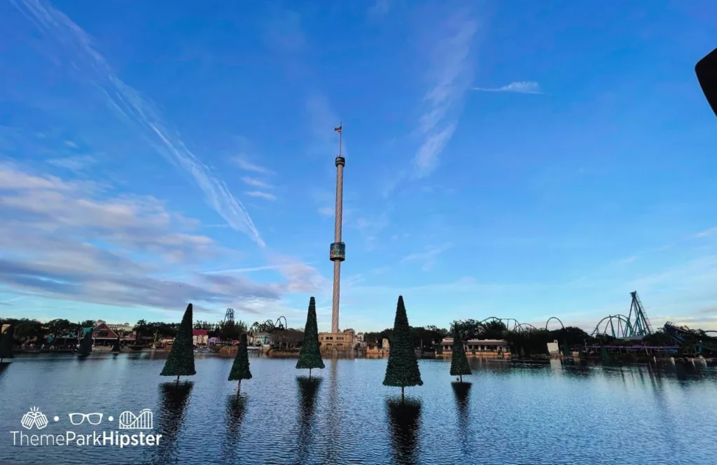 SeaWorld Orlando Resort Christmas Celebration Sea of Trees with Sky Tower in the Background. Keep reading to get the best SeaWorld Orlando tips, secrets and hacks.