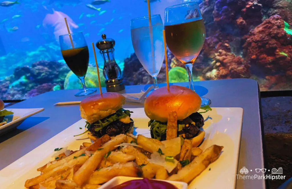 SeaWorld Orlando Resort Sharks Underwater Grill Kobe Beef Sliders with Wine. Keep reading to get the full SeaWorld Orlando parking travel guide.