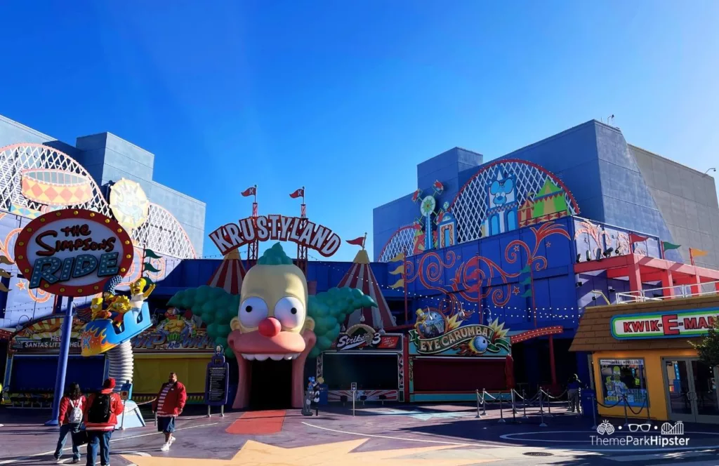 Universal Studios Hollywood Simpsons Land Springfield USA Krustyland Ride and KwikEMart. Keep reading to get the full guide on which is better Disneyland vs Universal Studios Hollywood.
