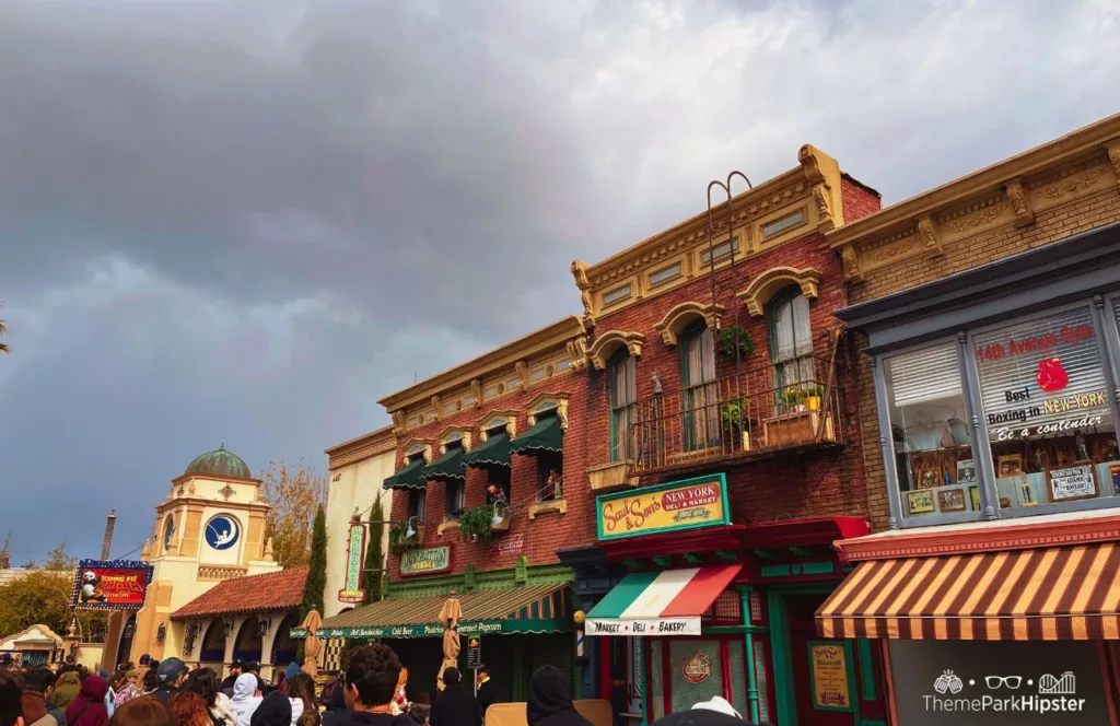 Universal Studios Hollywood Street Performers next to Kung fu Panda rainy day. Keep reading to know what to wear to Universal Studios Hollywood and how to choose the best outfit.