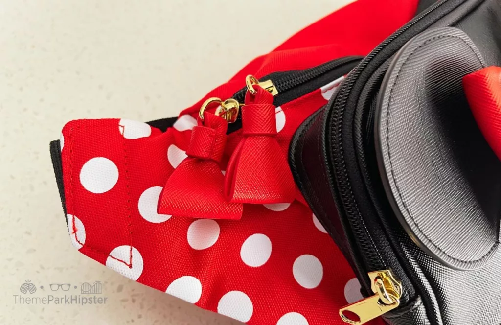 Winghouse x Minnie Red Ribbon Polka Dot waist pack. One of the Best Disney World Fanny Packs 