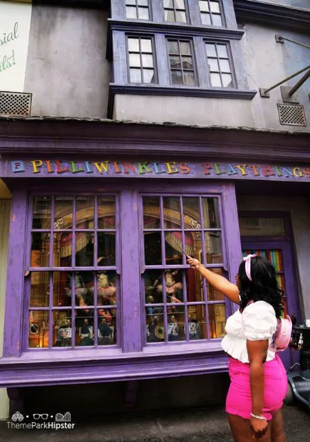 Best Spots for Wizarding World of Harry Potter Photos with Victoria Wade Playing with Wand at Pilliwinkles in Universal Orlando Diagon Alley
