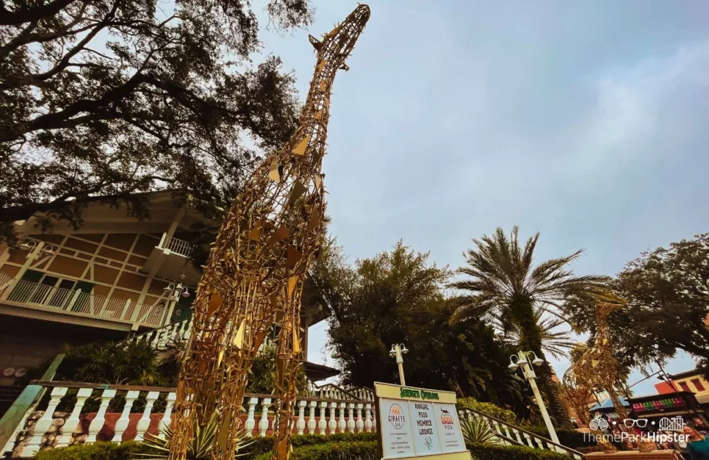 Busch Gardens Tampa Bay Giraffe Bar and Oasis Pizza elevator entrance with a Holiday giraffe on display. Keep reading to learn more about Busch Gardens Tampa animals.