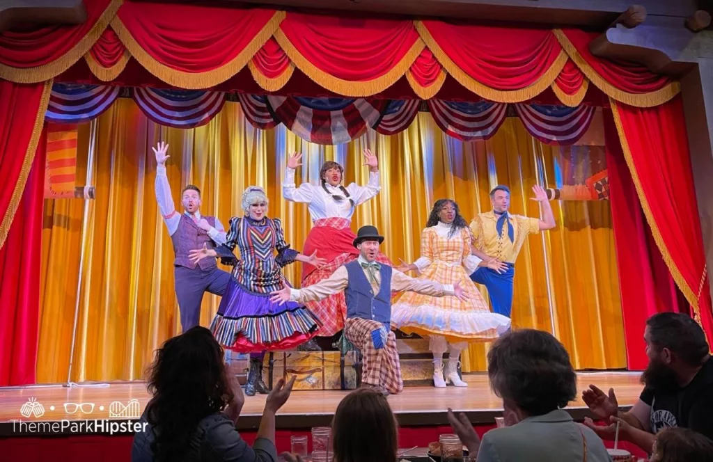Disney Wilderness Lodge Resort Hoop Dee Doo Musical Revue performers on the stage. One of the best moderate resorts at Disney World for adults.