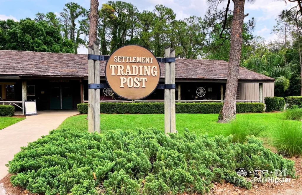 Disney Wilderness Lodge Resort Settlement Trading Post Store surrounded by greenery. Keep reading to find out more of the best things to do at Disney World on a solo trip.