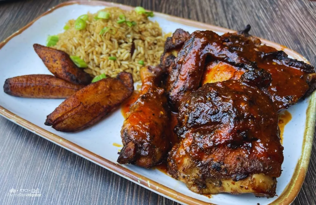 Universal Orlando Resort Bob Marley a Tribute to Freedom Restaurant in CityWalk Jamaican Jerk Chicken with rice and plantains. Keep reading to get the best things to do at Universal Orlando for adults.