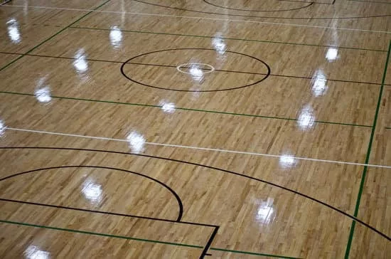 Lights shining on hardwood floor of basketball court. Keep reading to learn more about the best things to do at Cedar Point. 