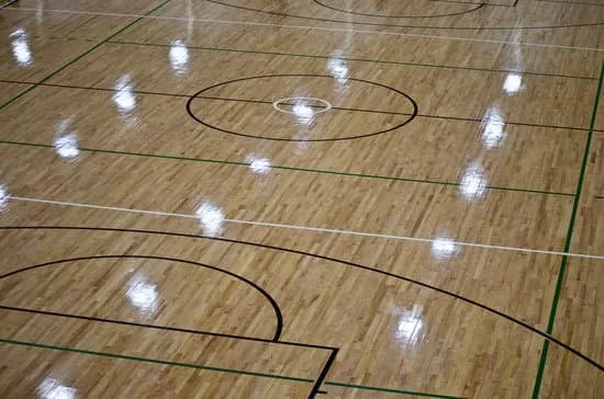 Lights shining on hardwood floor of basketball court. Keep reading to learn more about the best things to do at Cedar Point.