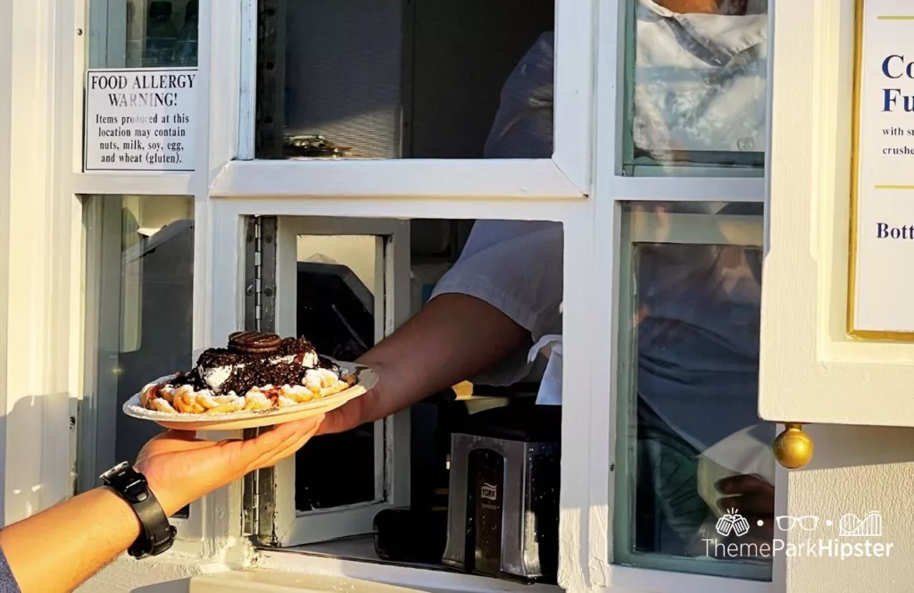 2023 Epcot Food and Wine Festival at Disney Cookies n Cream Funnel Cake. One of the best snacks at EPCOT. 