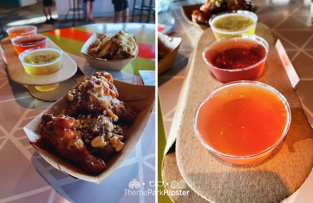 2023 Epcot Food and Wine Festival at Disney Odyssey Cider Flight with Parmesan and Peanut Butter and Jelly Chicken Wings. One of the best things to do in Orlando in October.
