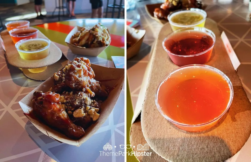 2023 Epcot Food and Wine Festival at Disney Odyssey Cider Flight with Parmesan and Peanut Butter and Jelly Chicken Wings.