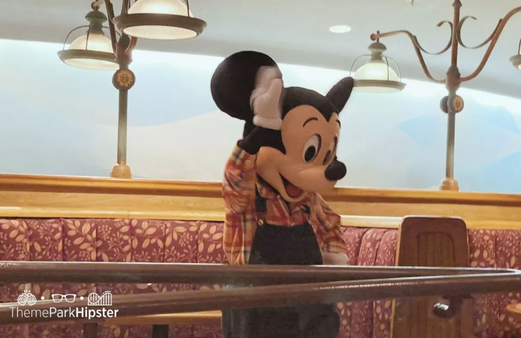 2023 Epcot Food and Wine Festival at Disney The Land Pavilion Garden Grill with Mickey Mouse Character Meet and Greet Buffett. Keep reading to learn more about character experiences at Disney World. 
