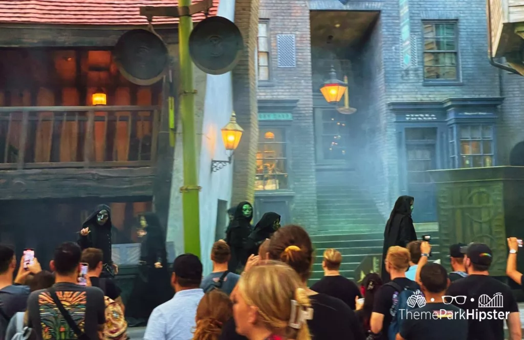 Death Eaters in Diagon Alley at The Wizarding World of Harry Potter during 2023 Halloween Horror Nights HHN Universal Studios Orlando. Keep reading to discover more about Halloween at Universal.