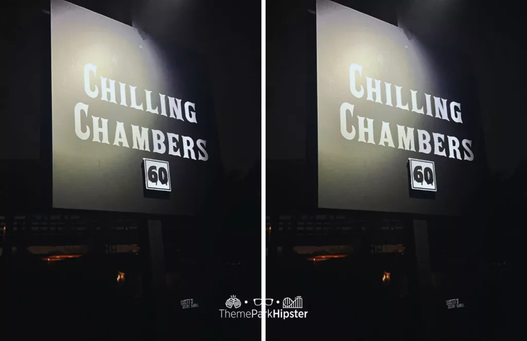 Chilling Chambers wait times  on a black and white sign indicating 60 minutes to wait at the 2023 Knott's Scary Farm at Knott's Berry Farm in California. Keep reading to discover more about Knott’s Scary Farm mazes.