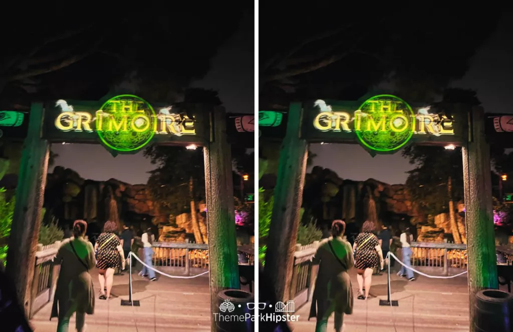 The Grimoire House entrance  glowing in green and yellow as theme park guests walk through at at Knott's Berry Farm in California for the 2023 Knott's Scary Farm. Keep reading to discover more about Knott’s Scary Farm mazes.
