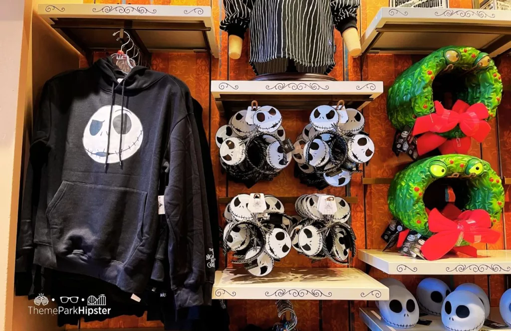 Disney Halloween Merchandise at Magic Kingdom Theme Park Nightmare Before Christmas Sweater and Wreath. Keep reading to learn what to pack and what to wear to Disneyland in September.