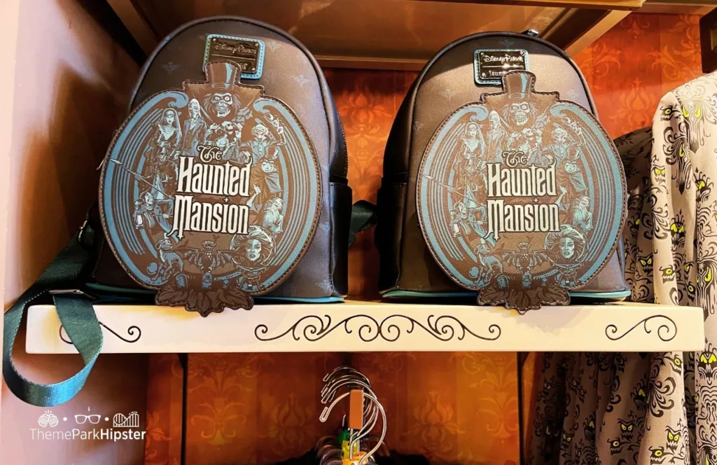 Disney Haunted Mansion Merchandise at Magic Kingdom Theme Park Loungefly Backpack Bag. Keep reading for more Disney Haunted Mansion Merchandise Gift Ideas.