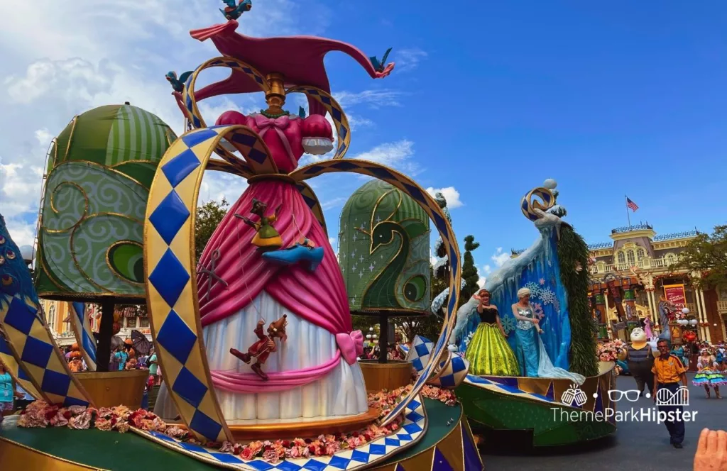 Disney Magic Kingdom Theme Park Festival of Fantasy Parade Frozen with Anna and Princess Elsa. Keep reading to learn the difference between alone vs lonely and how to have the perfect solo Disney World trip.