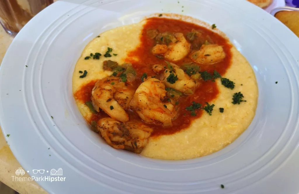 Shrimp and Grits at Princess and the Frog Tiana's Palace Restaurant at Disneyland. Keep reading to discover more about Tiana’s restaurant.