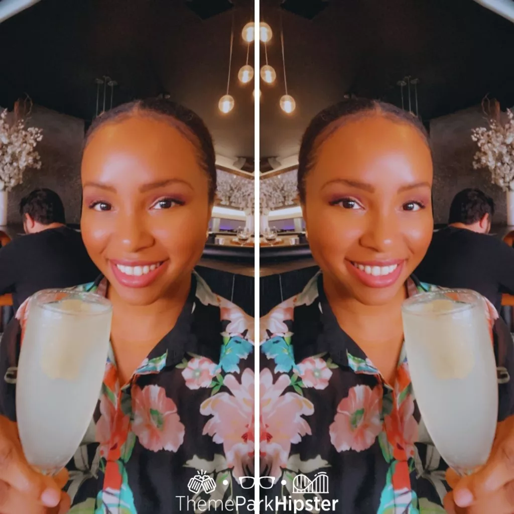 STK Orlando Disney French 75 with NikkyJ. Keep reading to know which is better Disney World vs Universal Studios.