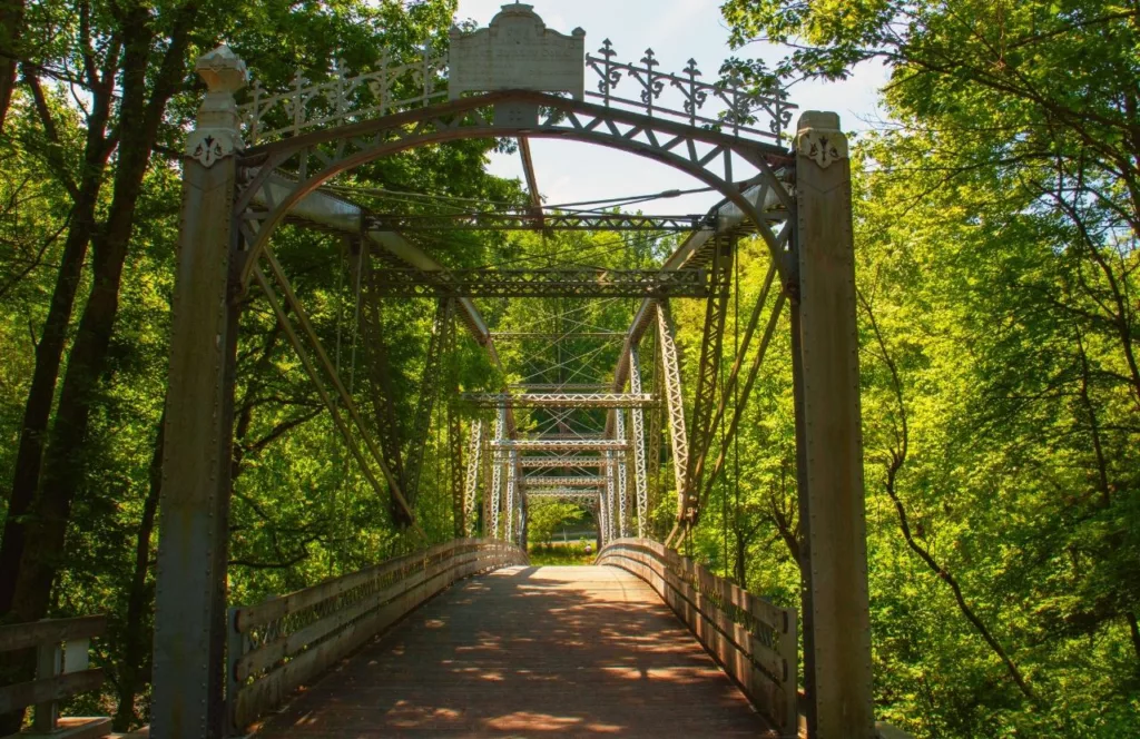 Swatara Creek Park Bridge with intricate historic features and design with lush trees surrounding picturesque bridge near Hersheypark.Keep reading to discover all the best things to do around Hersheypark.