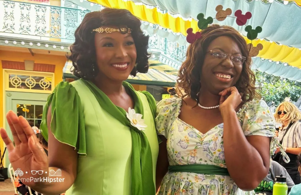 Victoria Wade and Princess and the Frog Tiana's Palace Restaurant at Disneyland. Keep reading to know what to pack and wear to Disneyland in April for the perfect spring outfit.