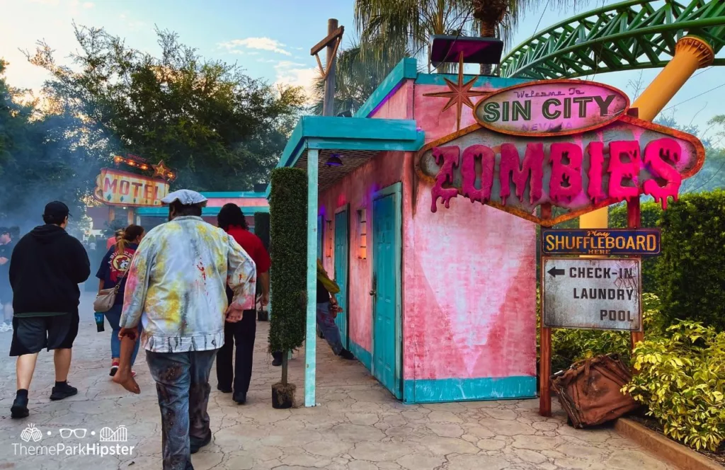 2023 Howl O Scream at Busch Gardens Tampa Bay Las Vegas Sin City Zombie Scare Zone.  Keep reading to find out what Busch Gardens Howl-O-Scream is and get my best Busch Gardens Howl-O-Scream tips for first-timers.
