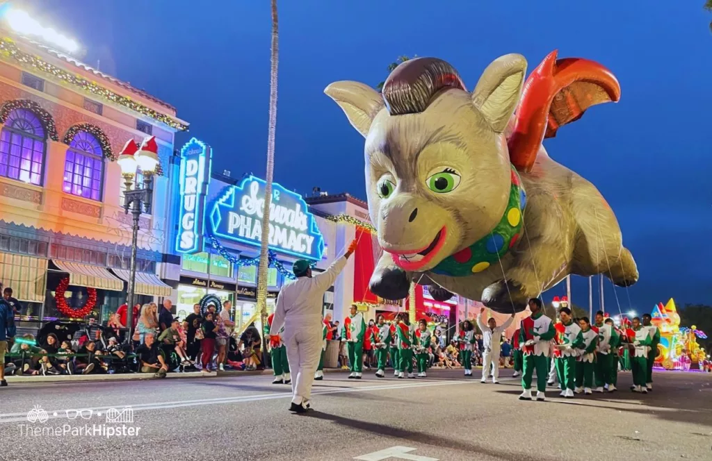 Christmas at Universal Orlando Holiday Parade featuring Macy's Donkey Dragon from Shrek. Keep reading if you want to discover more about Macy’s Holiday Parade at Universal Studios Florida.