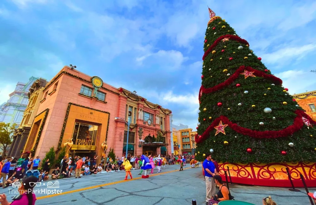 Christmas at Universal Orlando Holiday Tree in front of Tribute Store. Keep reading to discover more about Universal Studios Holiday Parade.