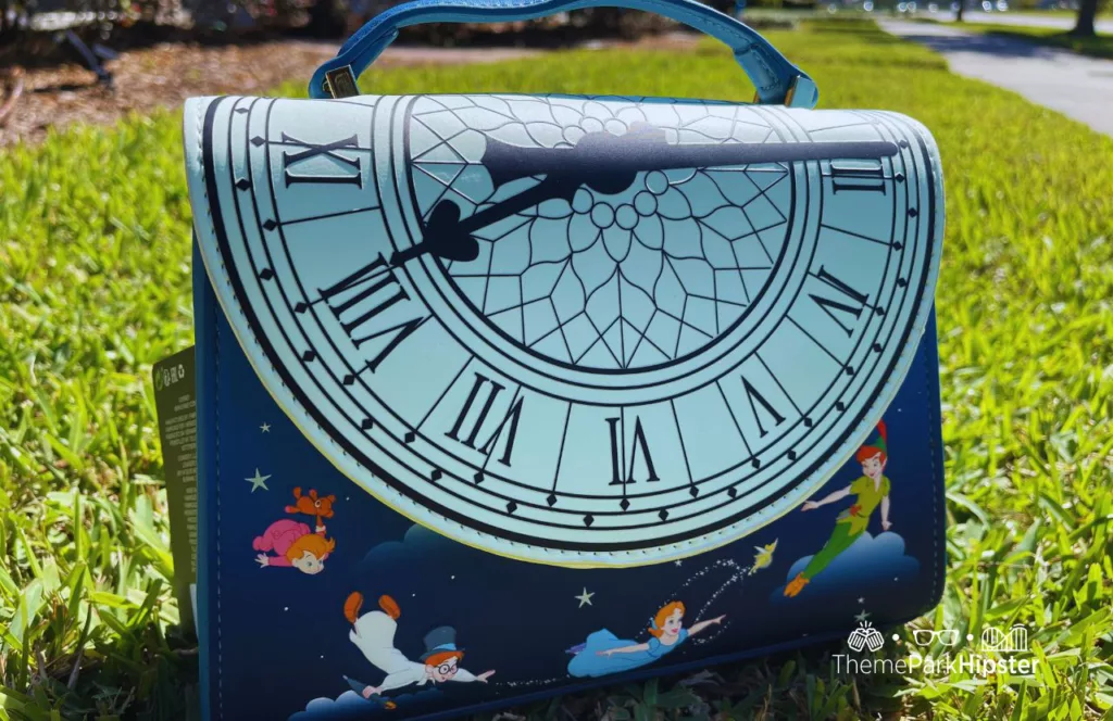 Peter Pan Loungefly Glow in the Dark Crossbody Bag. one of the best Disney World souvenirs to buy for your trip!